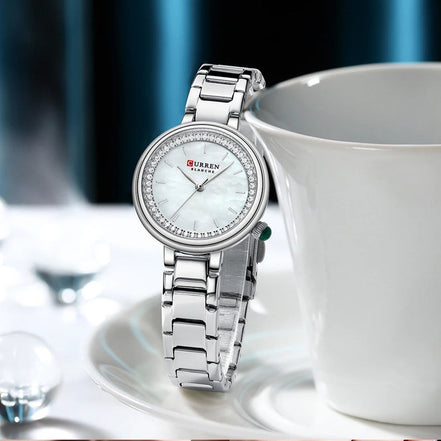 Reloj CURREN 9089 para mujer, variante plateado con esfera blanca